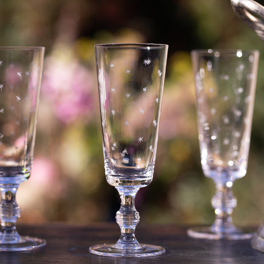 Four Champagne Flutes with Stars Design by Vintage List